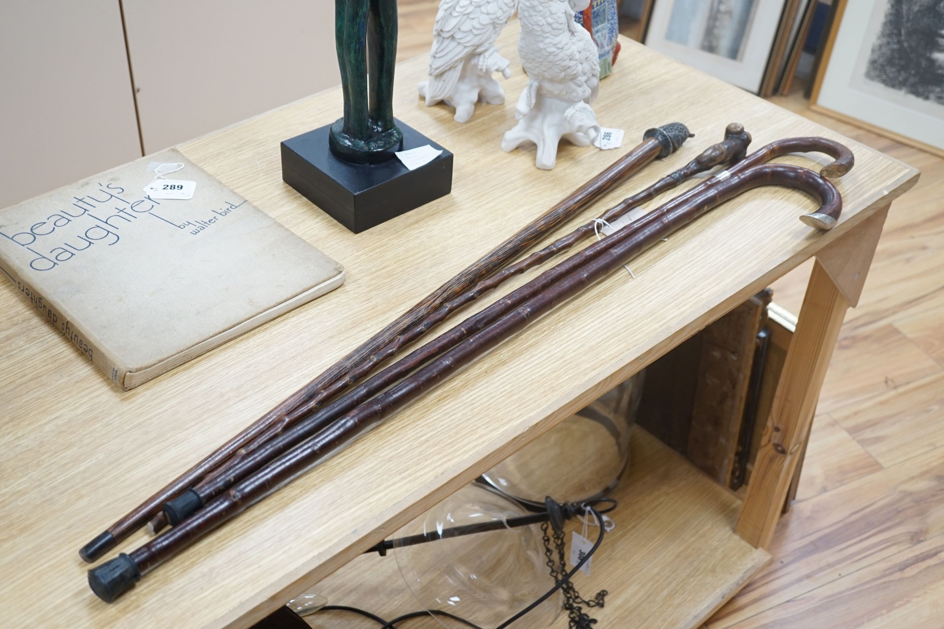 A silver mounted George V walking cane dated:London 1919 and 3 other canes, Silver mounted cane 92 cms long.